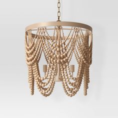 a wooden chandelier with beads hanging from it