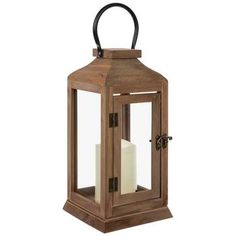 a wooden lantern with two candles in it