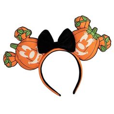 an orange mickey mouse ears headband with pumpkins on it