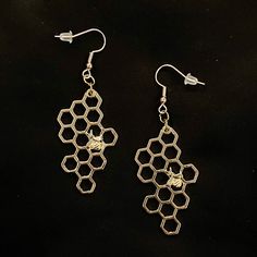 "Please read descriptions thoroughly for sizes and materials. This is darling pair of gold metal honey combs with cute little bees crawling around on them. They are just under 2 3/4\" long, and just under 1\" wide. Make sure to check out my shop for more hair pins, jewelry, accessories, and all sorts of fun stuff! Bee Earrings, Insect Earrings, Gold Bee, Honey Bee, Bumble Bee, Insect Jewelry, Bee Jewelry, Honey Comb, Hexagon Honeycomb, Bee Hive" Bumble Bee Insect, Insect Earrings, Honey Combs, Nerdy Jewelry, Pins Jewelry, Science Jewelry, Metal Smithing, Bee Honey, Bee Jewelry