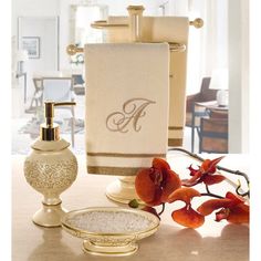 towels, soap dispenser and other items on a counter in a living room