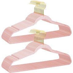 three pink and gold plastic hangers on a white background