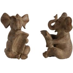 two wooden elephants sitting next to each other with their trunks in the shape of an elephant