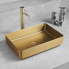 a bathroom sink with a faucet and soap dispenser next to it