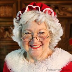 an older woman wearing glasses and a santa hat