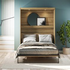 a bedroom with blue walls and wooden headboard