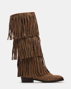 Upgrade your wardrobe with the SPUR fringe boot. These boots feature a fringe detailing that adds a touch of effortless style. Perfect for any occasion, these boots will elevate your look while providing comfort and durability. 1 inch heel height 14.5 inch shaft circumference 15 inch shaft height Suede upper material Synthetic lining Leather sock Synthetic sole Fit tip: If you are in between sizes, size up a half-size Imported Light Brown Cowgirl Boots, Fringe Boots Outfit, Boots With Tassels, Fringed Boots, Brown Cowgirl Boots, Black Fringe Boots, Free People Boots, Suede Fringe Boots, Fringe Shoes