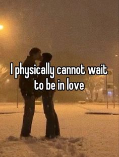 two people standing in the snow with their arms around each other and texting, i physically cannot wait to be in love