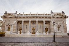 a large white building with columns and pillars