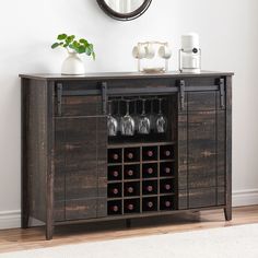 a wooden cabinet with wine glasses on it