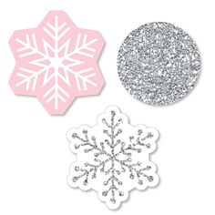 three snowflakes are shown in pink and silver, one with glitter on it