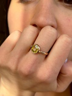 This faceted oval greenish yellow Tibetan citrine ring exudes a casual elegance. With it's bold design wear it solo or layer with others for a subtle, yet regal sophistication. Citrine is the stone of Abundance. It is best used when it comes in constant contact with the skin. Citrine 8x7mm 9K rose gold Size available 18 Please contact us for sizing options Please contact us for availability Follow us on Instagram: https://www.instagram.com/missionewyork/ Oval Green Citrine Rings, Tourmaline Rings, Stone Ring Design, Yellow Citrine Ring, Yellow Ring, Constant Contact, Jasper Ring, Yellow Rings, Gold Ring Designs