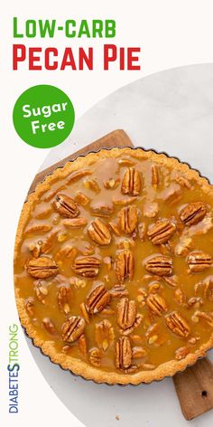 a pecan pie on a wooden board with the title low carb pecan pie