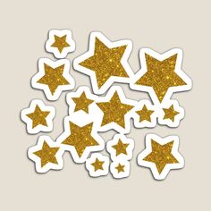 gold glitter stars stickers are arranged in the shape of small, star shaped shapes