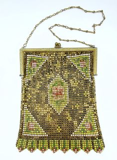 an antique beaded purse on a chain