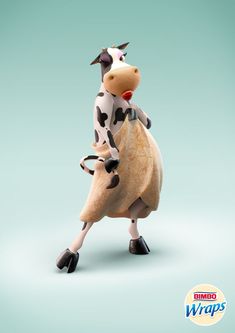 a toy cow riding on the back of a wooden object in front of a blue background