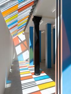 the columns are painted with different colors and patterns