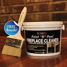 a paint can and brush sitting on top of a wooden table