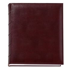 a brown leather notebook with braiding on the front and bottom cover, open to reveal an empty page