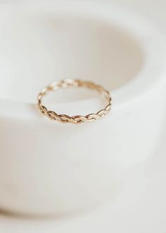 An ode to our idol, Willie Nelson: meet Nellie! This flat, woven style reminded us of Willie's iconic braids so we named this ring after the legend himself! Band measures 2.4mm wide. Available in 14kt Gold Fill + Sterling Silver. Claire pairs it with the Starburst Ring, Beaded Ring and Midi Wrap Ring. Dani pairs it with our Sterling Silver Cigar Band, Dani Chain Ring, and two Sterling Silver Beaded Rings. Our jewelry is handmade so each piece will be unique and may vary slightly from what is pic Ring Flatlay, Confetti Ring, Jewelry Knowledge, Everyday Wear Jewelry, Jewelry Photoshoot, Beaded Ring, Hammered Rings, Willie Nelson, Handmade Jewelry Designs