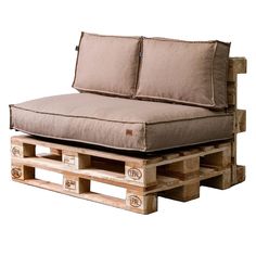 a couch made out of wooden pallets with pillows on it's back end