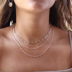 Our Gemma Chain features a timeless, dainty double rope that blends modern style with classic sophistication! It is perfect to wear alone or layer up with a fun necklace stack. DETAILS14k gold fill or sterling silverAvailable in 14", 16", 18", or 20"Hypoallergenic, waterproof, and nickel free Dainty Silver Necklace Stack, Gold And Silver Necklaces Layered, White Gold Jewelry Necklaces, Silver Necklace Stack, Dainty Silver Jewelry, Homecoming 2024, Chain Necklace Silver, Necklace Stack, Sterling Silver Choker