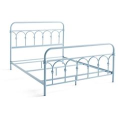 a white metal bed frame with an arched design on the headboard and foot board