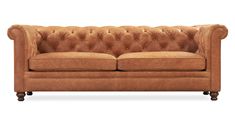 a tan leather couch with buttons on the armrests and back rest, viewed from the front