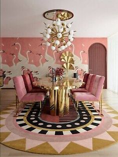 a fancy dining room with pink chairs and gold accents