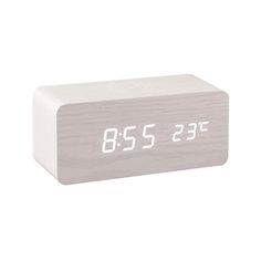 an alarm clock with the time on it's display is shown against a white background