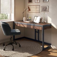 a home office with a desk, chair and pictures on the wall in front of it