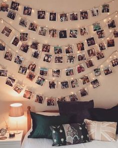 a bed topped with lots of pictures and lights