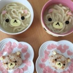 three bowls filled with soup and teddy bears on top of each bowl are decorated with hearts