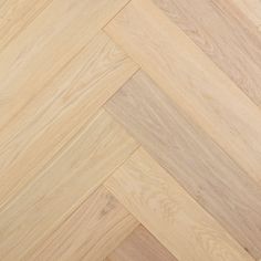 an image of wood flooring that looks like herringbones or chevron lines