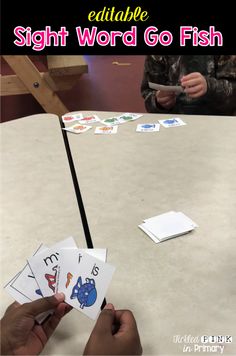 the sight word go fish card game is being played by two children at a table