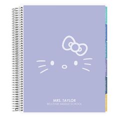 a spiral notebook with an image of a hello kitty on the front and back cover