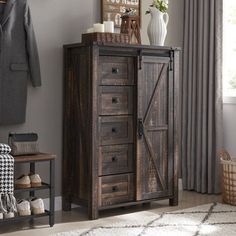 a wooden cabinet sitting in front of a window next to a rug and coat rack