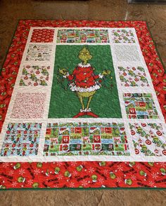 a quilted christmas themed table runner with the grin on it's center piece