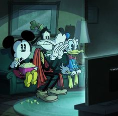 mickey and goofy eating popcorn together in the living room at night with their eyes closed