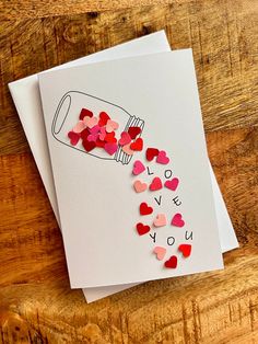 valentine's day card with hearts spilling out of a bottle