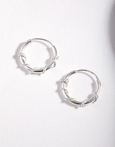 Description
Classic, bold, and always on-trend, sterling silver jewellery pieces will round out your collection and become your new daily staples. Style up your wardrobe with go-to styles made with precious metals. This pair of small hoop earrings closely hug the ear and feature a textured wrap-around rope design.

Size: 12mm (L) x 11mm (W) 
Weight: 0.6g (single earring) Twist Hoop Earrings, Fashion Jewellery Online, Rope Twist, Bold Earrings, Small Hoop Earrings, Sterling Silver Jewellery, Rope Design, Single Earring, Favorite Rings