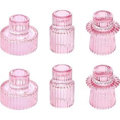 four pink glass jars are shown on a white background