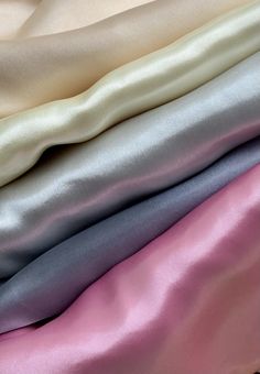 four different colors of satin fabric