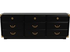 a black dresser with gold handles and drawers