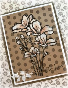 a close up of a card with flowers on it and polka dots in the background