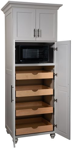 an open cabinet with drawers and a microwave on it's door, in front of a white background