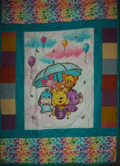 a quilted wall hanging with winnie the pooh and friends holding an umbrella