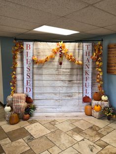 a decorated room with pumpkins and fall decorations