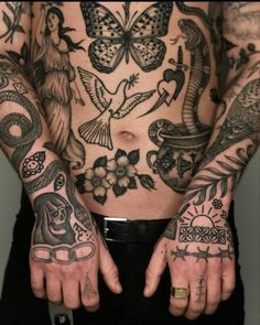 a man with tattoos on his chest and hands