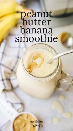 a banana smoothie in a glass jar with a spoon